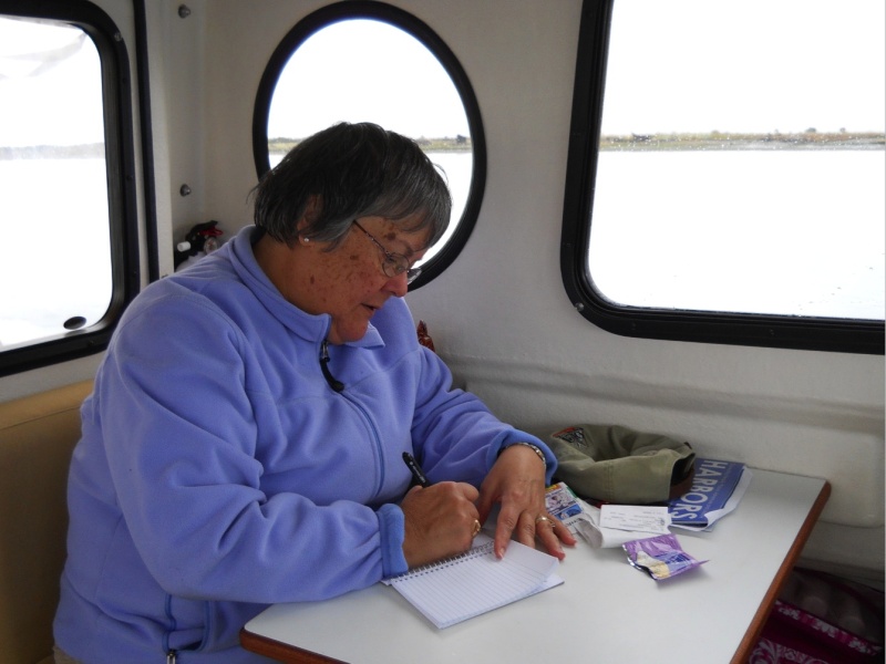 First Mate and CIC working on her log at the dinette table