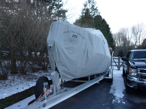 Fisher Canvas Products made the cover they are from Burlington New Jersey cover has vents pockets for three 2x4x10' The cover weighs around 70 pounds and will shrink a little in the coming weeks. I took the boat to him to get measured up but they do have patterns for 22' and 25's cost around 1200 dollars entrance door optional add 100