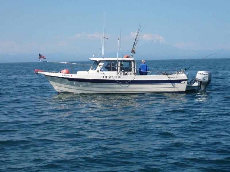 Fishing for Salmon on the "new" boat.
Smoking Mt.Redoubt volcano in the background.