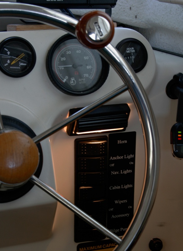 Flip light provides directed light onto the control switch panel. Very useful at dusk when you can't see the panel but do not want bright lights while your eyes adjust to the dark.