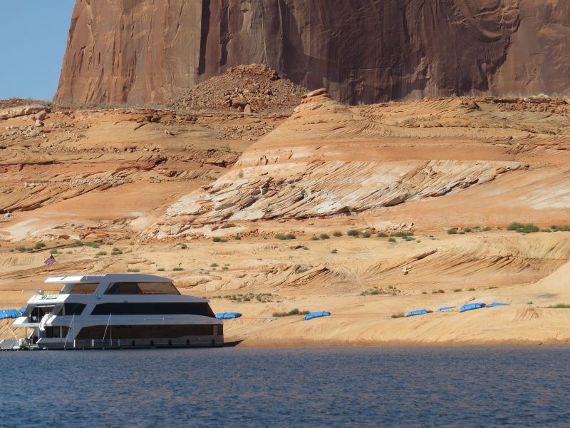 For a fee, you can have a service place water bags on the shore for securing your houseboat.
