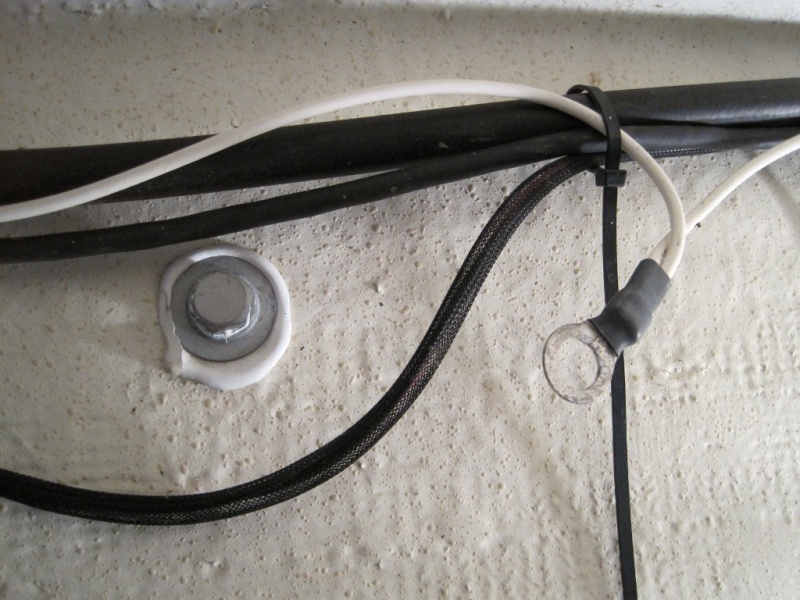 Forgotten gas tank grounding lug.