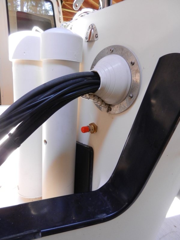 Fuel port next to outboard cable exit with rubber dust cap