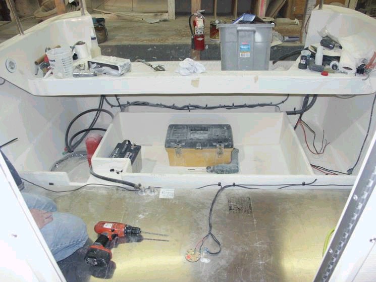 Fuel tank and fish box area (box is 31" by 58", store your Tuna, Salmon, Halibut, below deck).  Box will have split hinged lid and a macerator pump- out. This was my idea and Les and Cam made it happen. Thanks again Les & Cam. Areas to the side of the box are for storage and trim tab access. 3/15/04