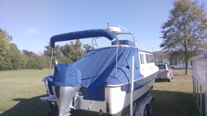 Full aft cover using Sunbrella. Keeping the rain out of the cockpit and leaving the hatches open for ventilation has resulted in a dry bilge. Normally a problem for the CD25...