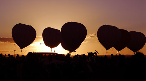 gas balloons at sunset