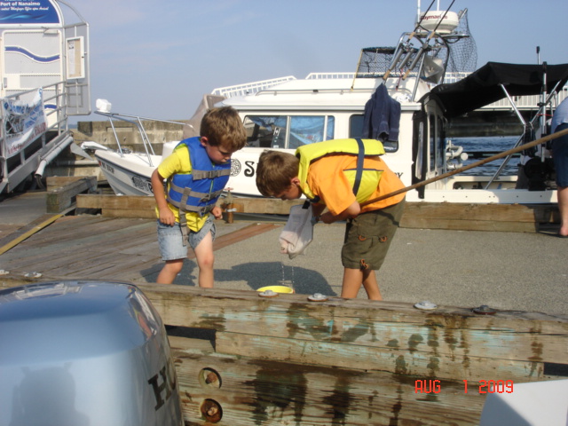 Griffin & Dominic checking their catch.
