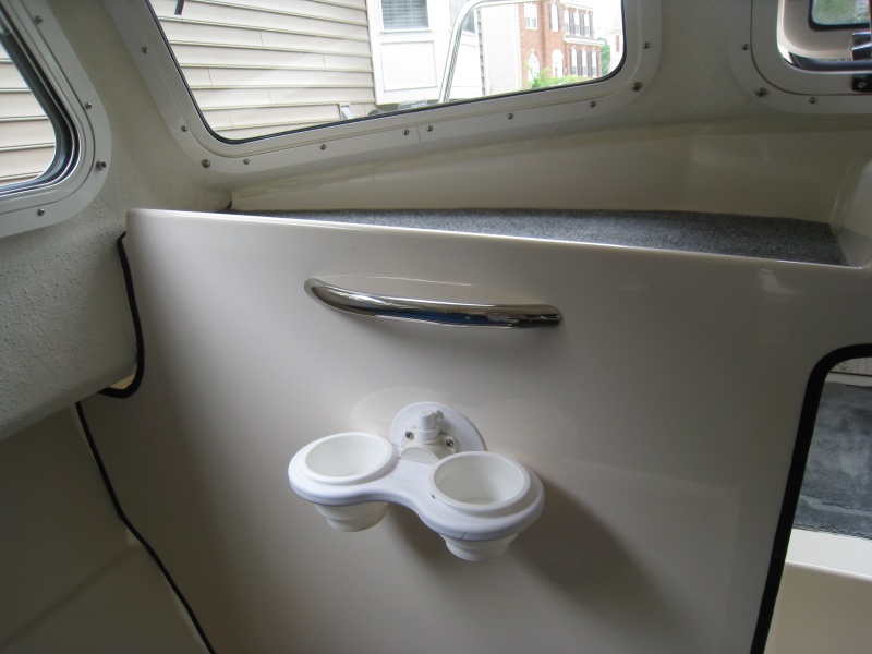 Hand hold from West Marine. Absolutely needed and shoulda come stock. SeaSucker cupholders are great!