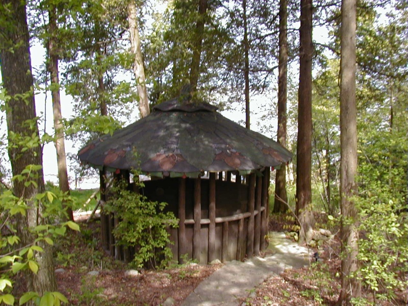He built this gazzabo with a "flower" looking shingled roof.  He built the gazzabo so his wife would come and read while he worked on the cottage.