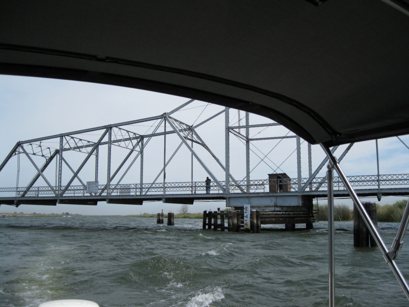 He only opens it enough for your boat to slip around the end at an angle. I think I gave him his exercise for the day - mostly bass boats through here.