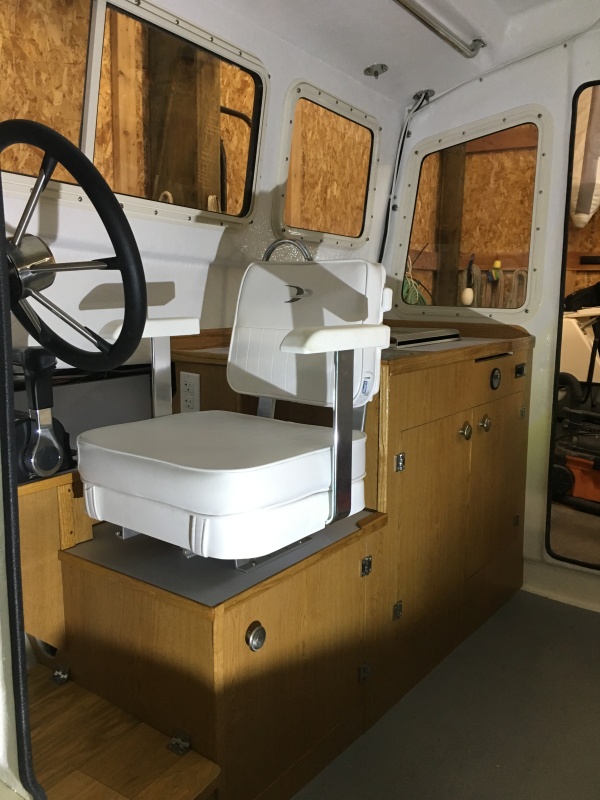 Helm chair will spin 360 degrees and can move fore and aft as needed for comfort.