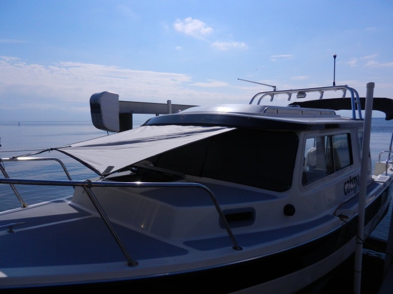 Here is the awning tied up at the top of the bow rail all the way around.