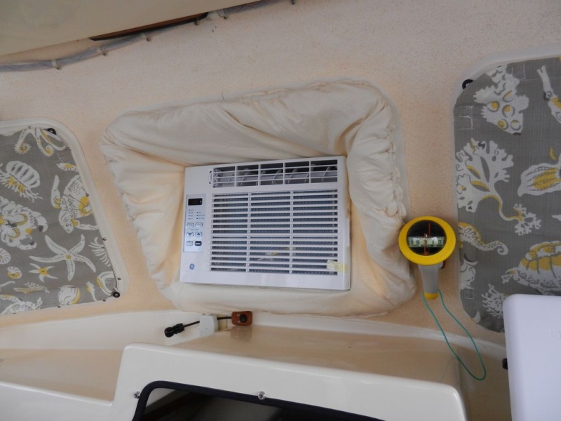 Here is the "in use" AC.  Kind of a cheezy '70's look with the fluffy opening cover, but I'll get used to it as it is blowing out cold air, I guess....