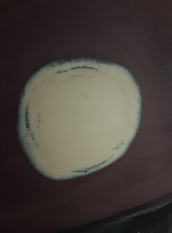 here is the patch I put over the old raw water washdown thruhull.  this time I tried to be more efficient by dishing it out, then glassing, then waiting for that to gel and putting the fairing compound over it before it was cured.  most of my time working on the boat has been grinding