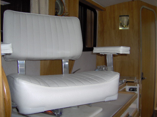 higher, wider, with arm rests