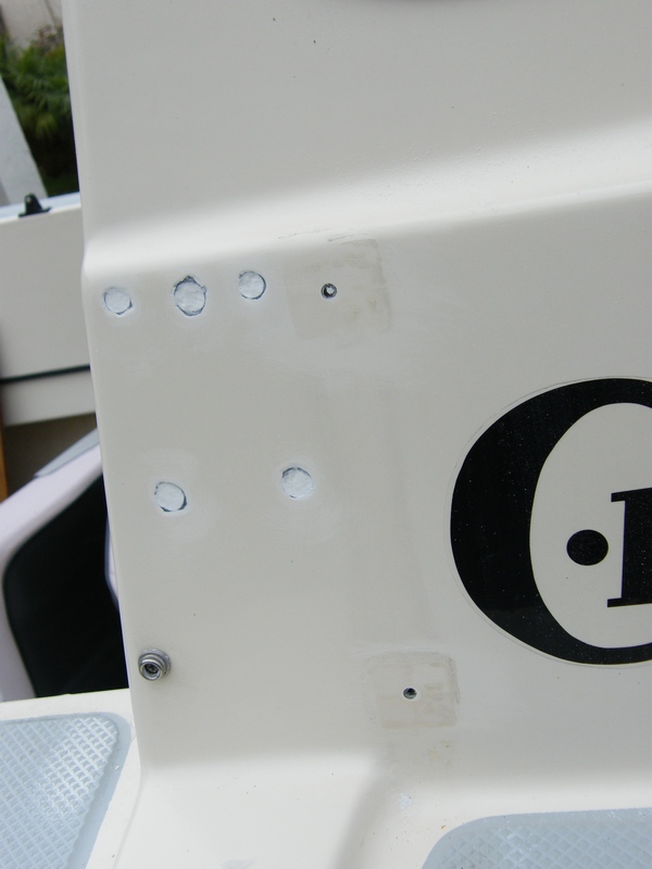 Holes were drilled out, cleaned, and surfboard epoxy filled.  Gelcoat will adhere to surfboard epoxy with no problems. Holes are ready for gelcoat.