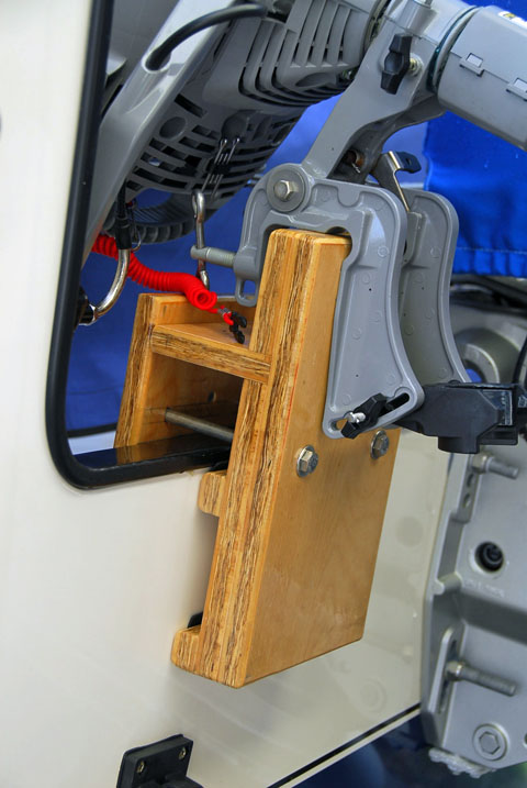 Honda 2 HP bracket with engine, closeup.