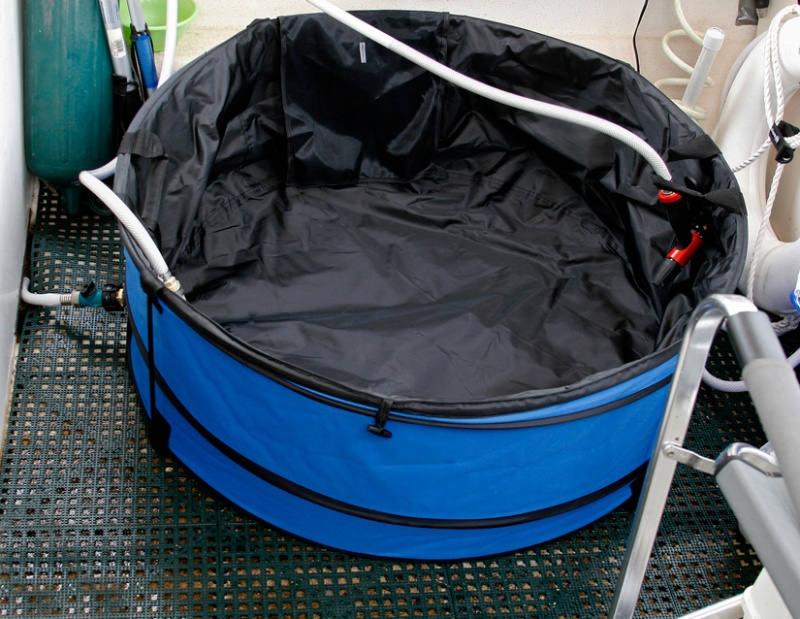 Hot Tub before filling - Return hose from the heat exchanger is terminated by a hose nozzle or a shower head. The hose nozzle is left open while water is recirculating.