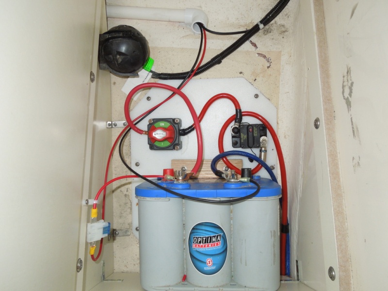 House battery installed by one the previous owners, re-installed to my standers; in forward passenger foot locker storage compartment.