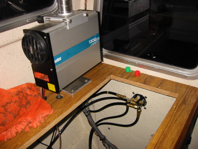 Hydraulics for cockpit helm station.  Note Wallas 1300 forced air heater
