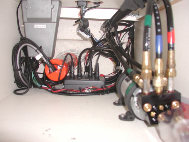 Hydrolic pump and computer under Helm seat.