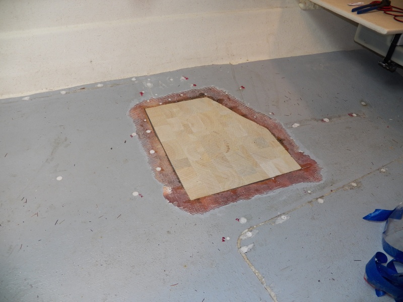 I could use heat to move core moisture around, but it looked like it was basically dried out the same as any lumber in my shop, so I cut the replacement piece for a trial fit.  The outlying holes have been filled, as have the old pop rivet holes.  Those will be drilled to accept stainless steel screws to hold the seat box.