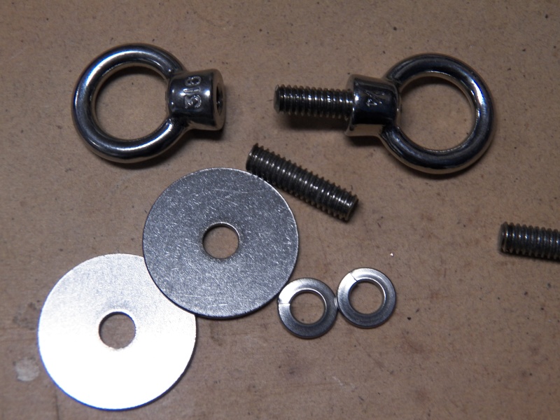 I found these stainless lift eyes on Amazon for $2 each.  When I tried to order more, the price had gone to $3.  I cut 1/4" stainless threaded rod to make the tie-down points that I wanted.