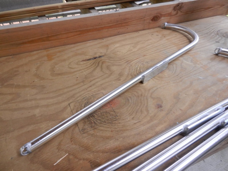 I had a local alumiinum guy bend some 1\" tubing and weld some end straps and a plate on each.  Plate location was an appoximation (with measurements) of the roof rail location.