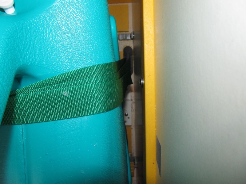 I had secured Weld Mount footman loops to the cabin sole to strap the "real" tank down to; using them now for holding the jugs in place with the green straps.