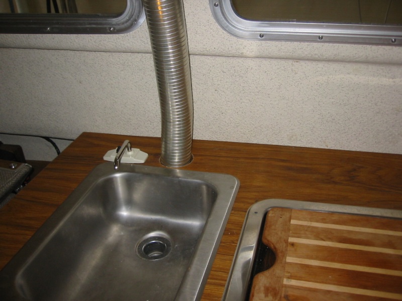 I had to reroute the sink drain to avoid the heater exhaust.(Rock-C)