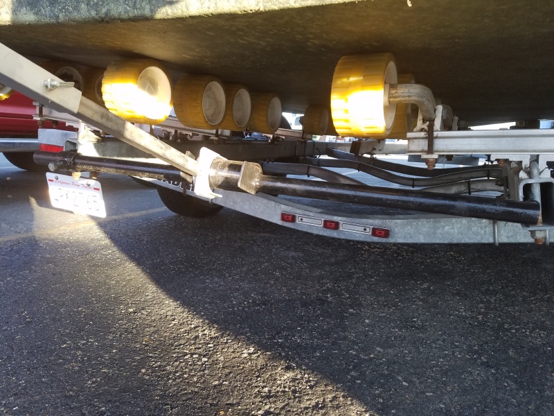 I made a steel pipe cross bar that has 20\" steel straps that slide up into the trailers tubing, now the outboard brace has a solid place to sit on.