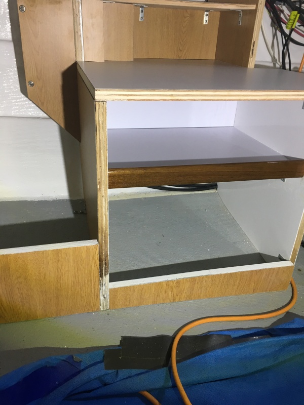 I put a backing plate in the back of the middle shelf to hide the wires and prevent stuff from falling in the back.