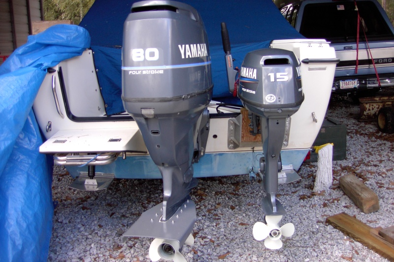 I run the kicker with the main raised and leaned to port.  Good room to turn the kicker. I enjoy cruising from the cockpit and don't use a steering rod.