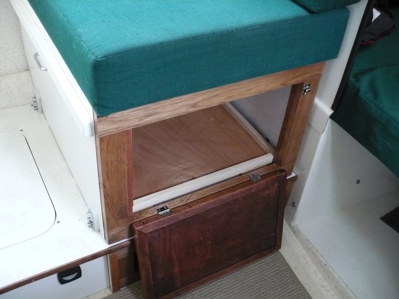 I started to build a drawer but did not like the loss of storage space. There is a lot of space in here. The base panel sits inside on little feet that raises it up above the 
T-Track.
