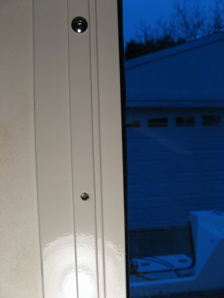 I tried to remove one screw and it snapped easily.  I've left the rest alone.  The head looked like there was stainless steel crevice corrosion happening, but I'm no expert on issues like that.