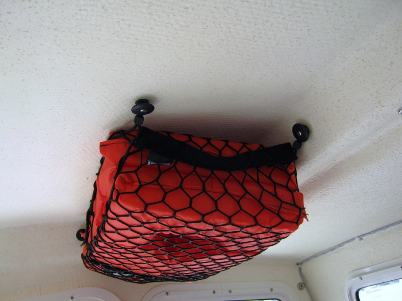 I used an expandable storage bag that I bought at SEARS.I rplaces the screws with 10-32 machine scrwes with cap nuts on top.Makes agreat life jacket holder.