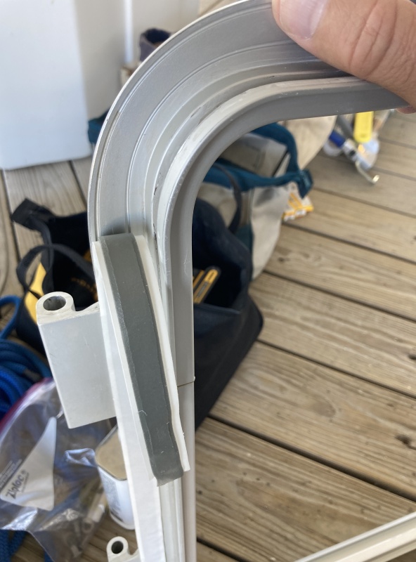 I used butyl tape (two layers in this application) from Sailrite to bed the frame.