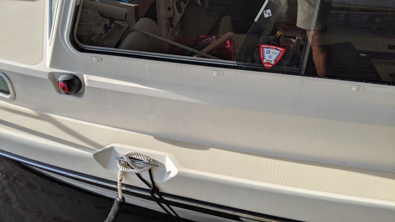 I used the heat gun with flat directing nozzle and a wide putty knife for removal.  Slow and steady, let the heat do the work, no gelcoat damage.  The cape cruiser name had been there for 14 years.  A light scrub with acetone removed all the glue and adhesive residue.  A quick buff with sopay water, then windex removed all the acetone. Water side vs dock side was a little dicey for all steps.  Should have reversed the boat in her slip for the starboard.