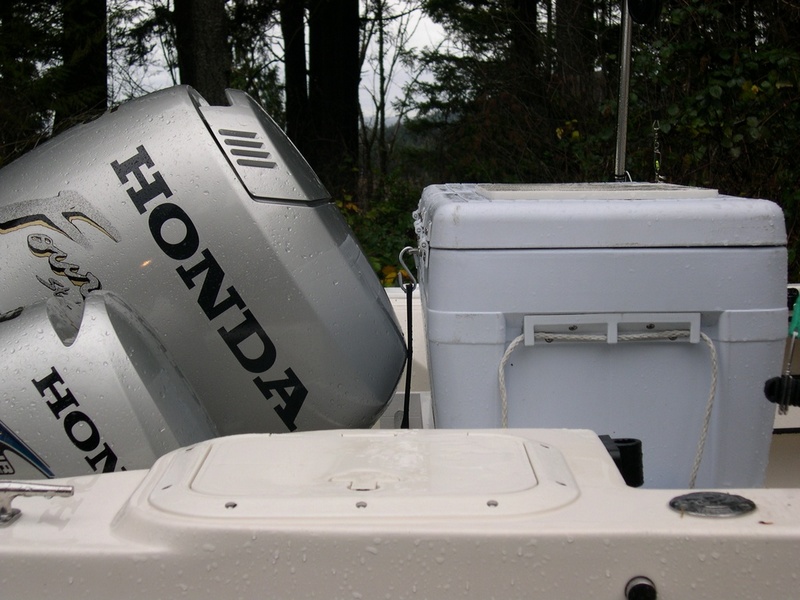 Image showing cooler in relationship to engines in maximum up-position.  Note placement of cutting board on top of cooler for bait cutting.