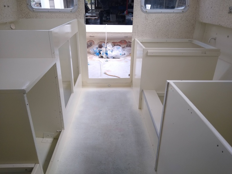 Interior reassembled, sprayed with Pettit EZ-poxy.  My biggest complaint was recoat time which was 16hrs. I would use the Performance enhancer if I was to do again.