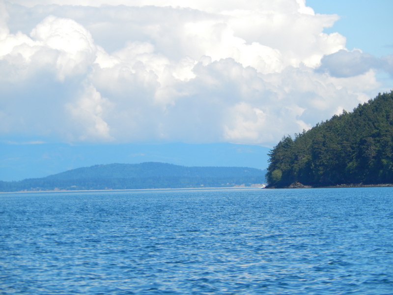 Islands, clouds, and blue water