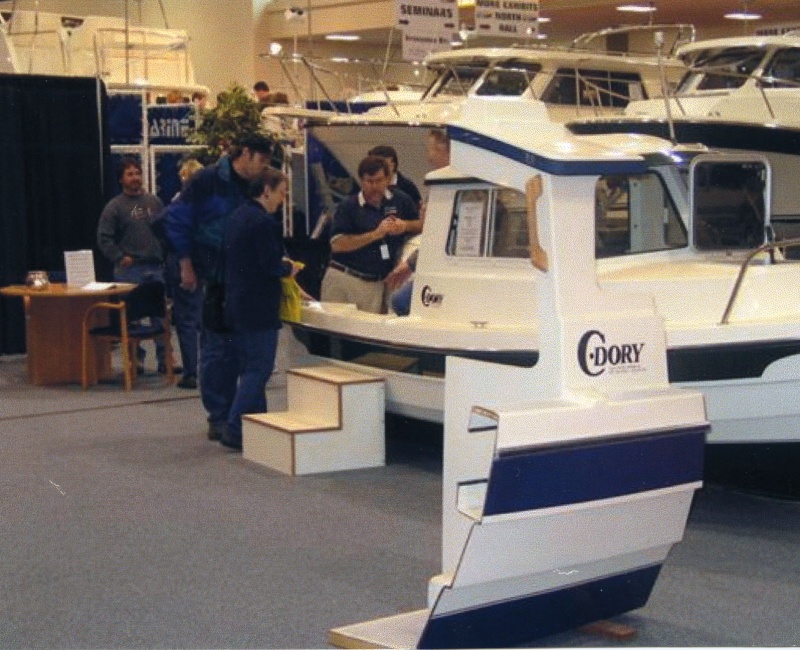 Jan 2003 Joe (in boat) Les (EQ Marine), Ruth & youngest son (blue jacket) at Seattle Boat Show
