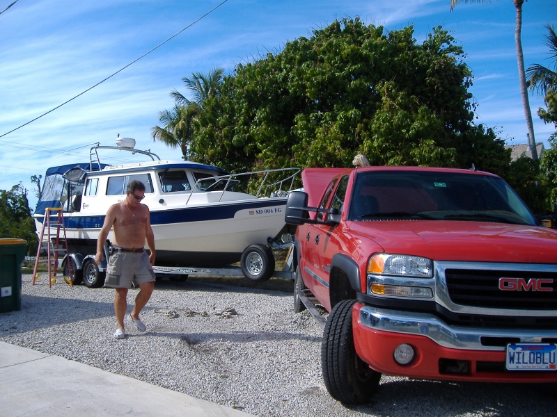 Jim is fixing the rutts he made in the drive....some people.