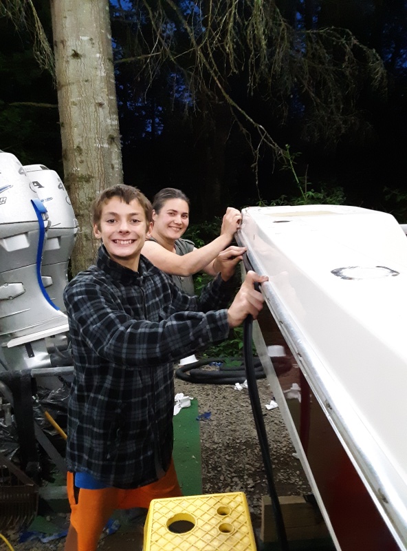 Josie and Logan putting in the rubber strip