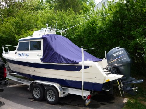Just zip the top edge on do some snaps and wala,clean boat