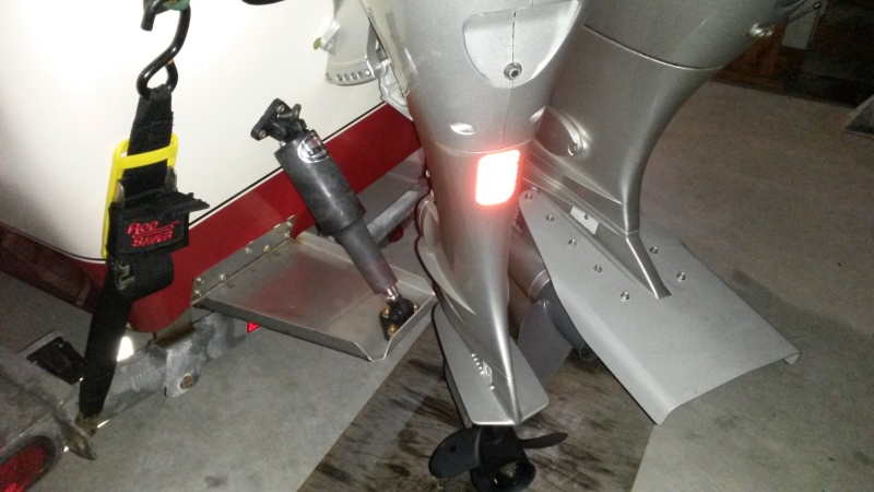 Kicker mounted to transom full lock port. 5/8" clearance from Lenco trim tab.