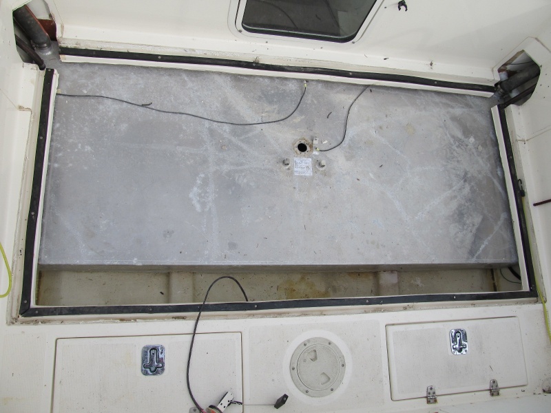 Leaking tank. Bottom of pic is too the stern. Two spacers in bilge have worn hole in tank about 1 1/2" up from the bottom