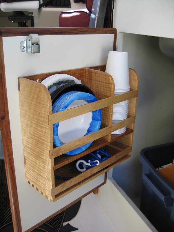 Left-hand cabinet door storage compartment.