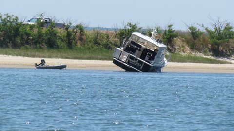 let the tide run out so he could clean the boat's bottom