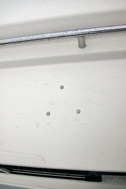 Light mounting ring screwed to overhead through the fiberglass as there was not a core to put screws into.